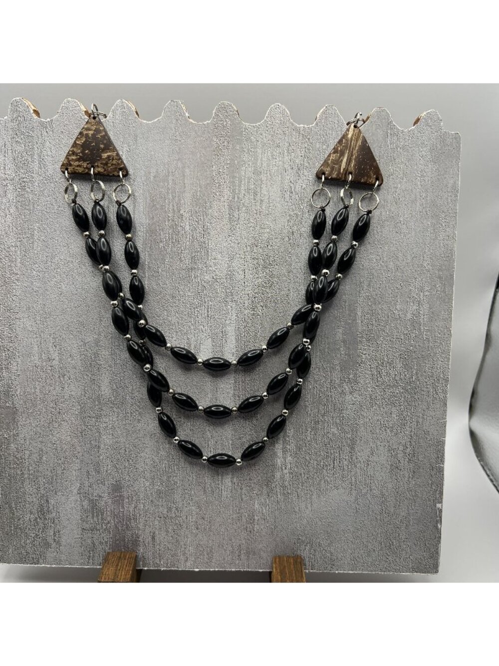 Three-Strand Black Bead Necklace With Coconut Shell Accents